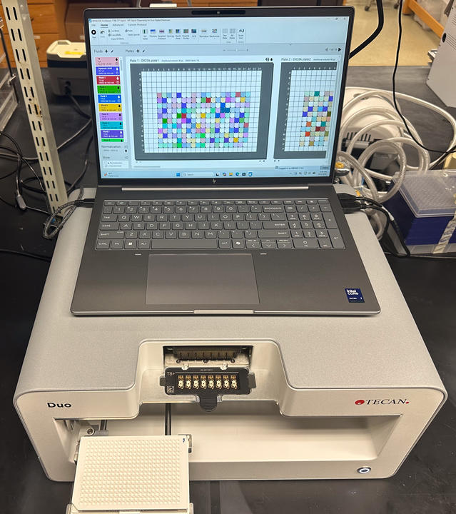 Tecan Duo with cassette, plate, and dispensing software